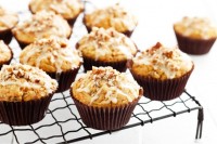 Banana, carrot and pecan muffins with orange icing
