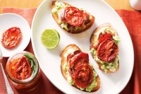 Avocado and fetta toast with semi-dried tomato and bacon