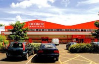 Booker Reports Decreased Sales-Rise