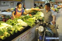 China's June inflation moderates to 2.3 pct