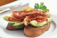 Avocado and lime with bacon on toast