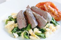 Barbecued lamb with warm beans and spinach