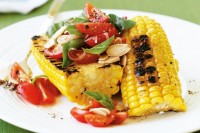 Barbecued corn with tomato and almond salad