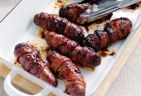 Sticky bacon-wrapped sausages